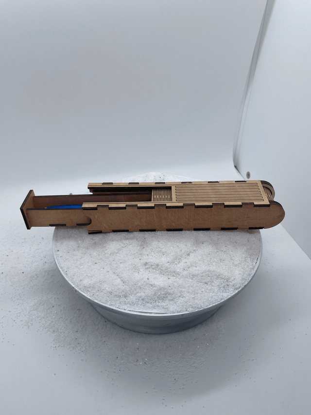 Coffret Stylo avec ouverture coulissante style boîte à pain.